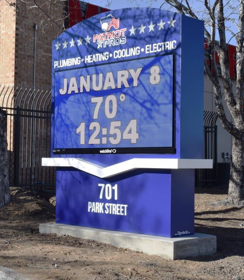 Patriot Pros Business Sign Displaying Date, Temperature, and Time.