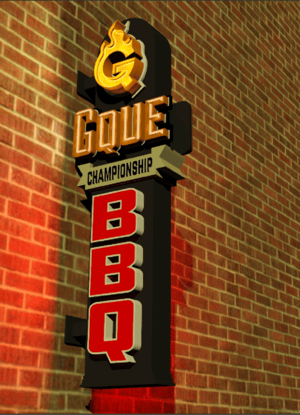 Gque Illuminated BBQ Sign in front of a brick wall