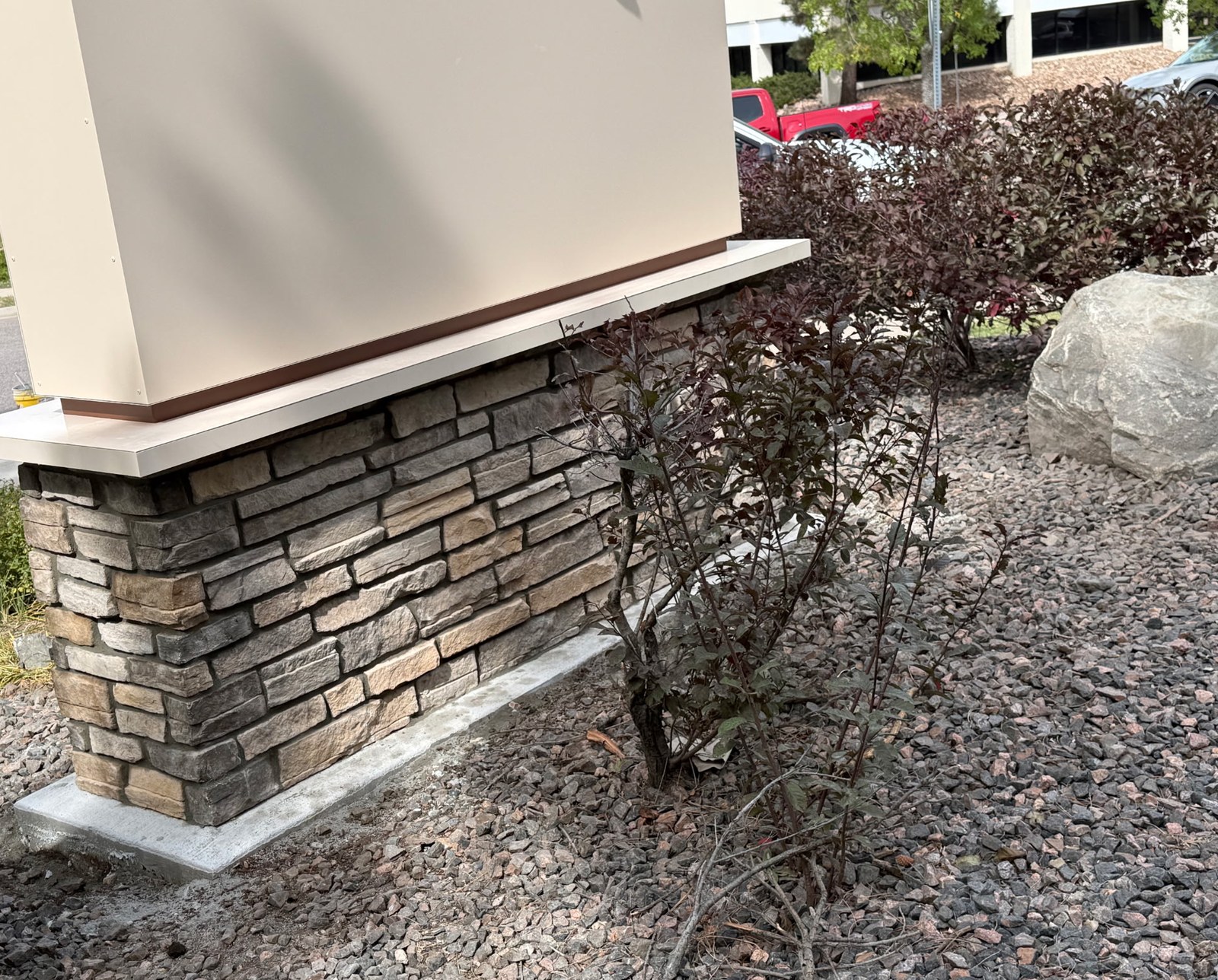 Close-up of the stacked-stone masonry base on the Golden View Classical Academy monument sign