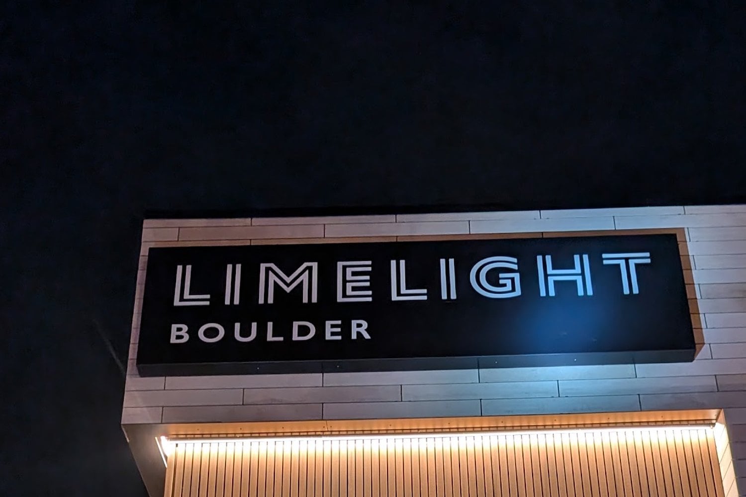 Limelight Boulder illuminated cabinet sign at night, Boulder, CO